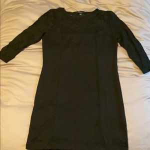 Black form fitting dress with lace top and arms
